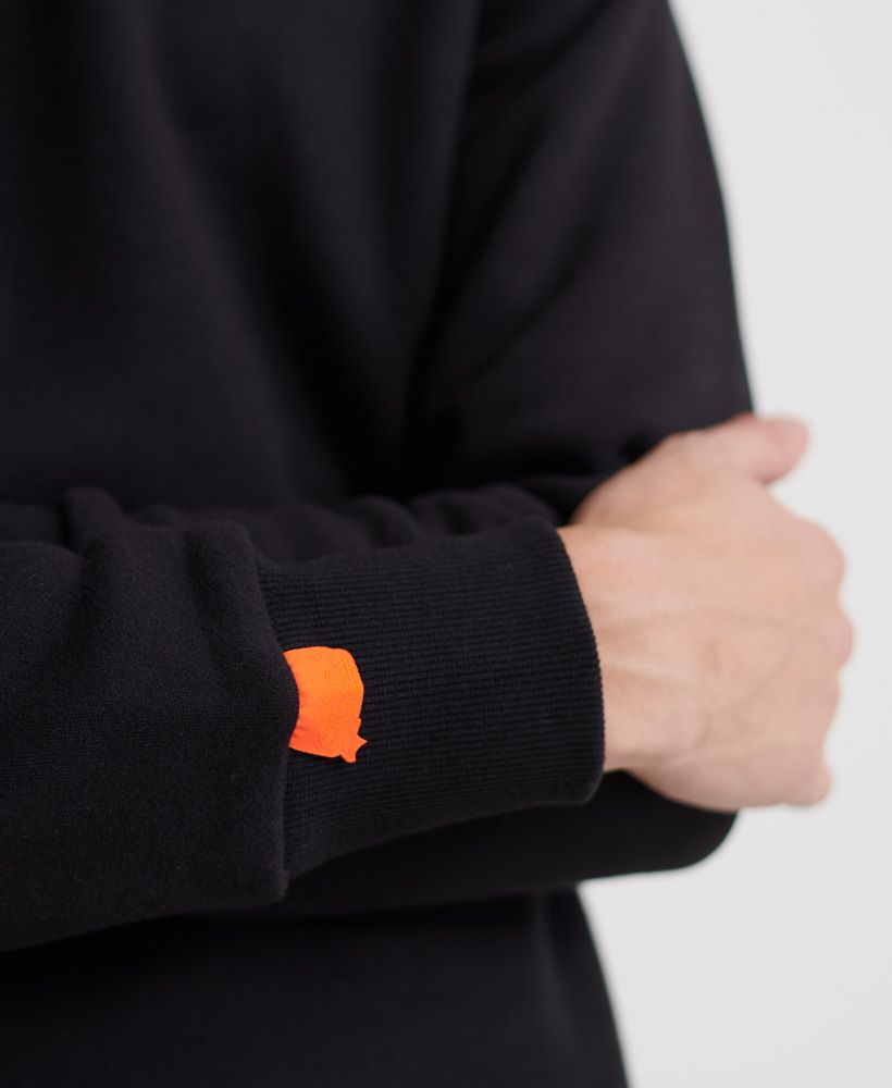 Superdry men's Crew sweatshirt from the Orange Label range. This crew neck sweatshirt features long sleeves and a ribbed collar, cuffs and hem. Finished with an embroidered Superdry logo on the chest and a Superdry logo tab on one cuff.Slim fit