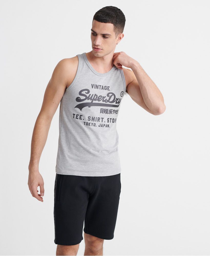 Superdry men's Vintage Logo bonded vest top. This sleeveless crew neck top features ribbed trims and is finished with a textured Superdry print across the front.