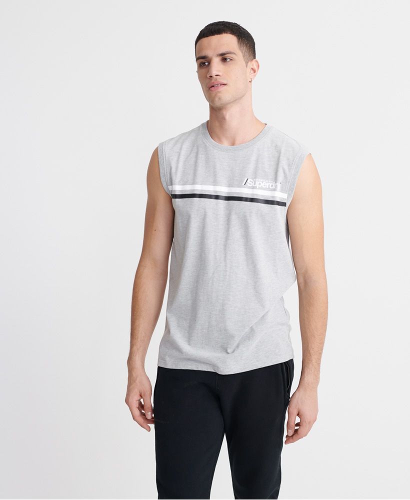 Superdry men's Core Logo Sport stripe vest. This vest features a ribbed crew neck and arm holes and a textured Superdry logo design across the chest. Complete with a Superdry logo tab featuring Japanese characters on one side seam. Pair with joggers and trainers for a post-gym look this season.