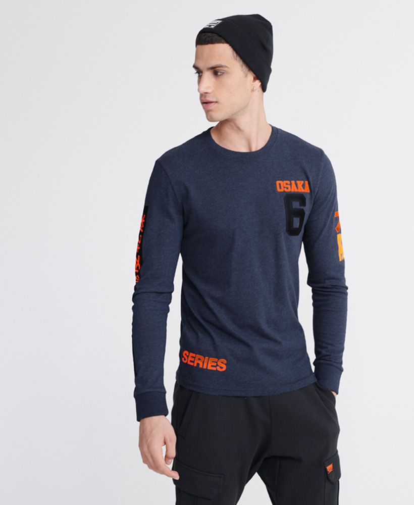 Superdry men's Osaka Series top. This long sleeved top features a crew neckline, and textured Osaka prints down the arm and across the back. Finished with a rubber Osaka 6 logo on the chest.