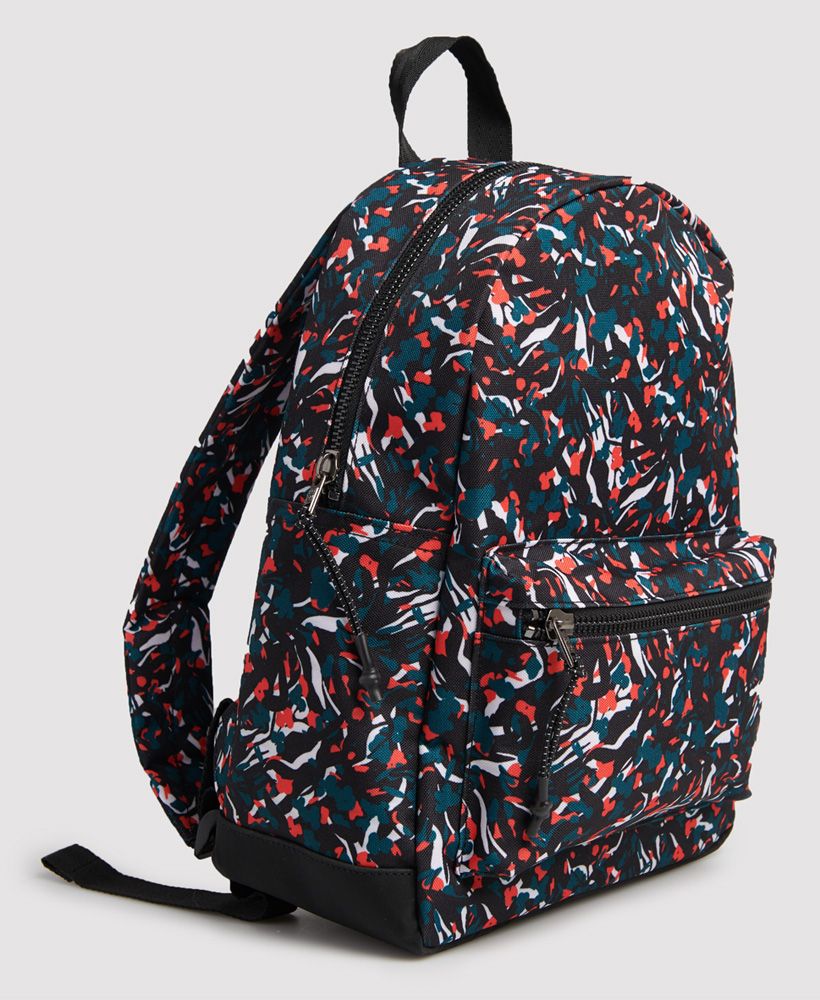 Superdry Women's Urban all over print backpack. This all over print backpack features a main zip compartment with laptop sleeve, a front zip pocket, a back sleeve pocket with hook and loop fastening, a grab handle, adjustable back straps and a soft bottom. Finished with Superdry branding to one side and a Superdry log tab with Japanese characters to the front pocket.H x 36cm D x 13cm W x 25 cm
