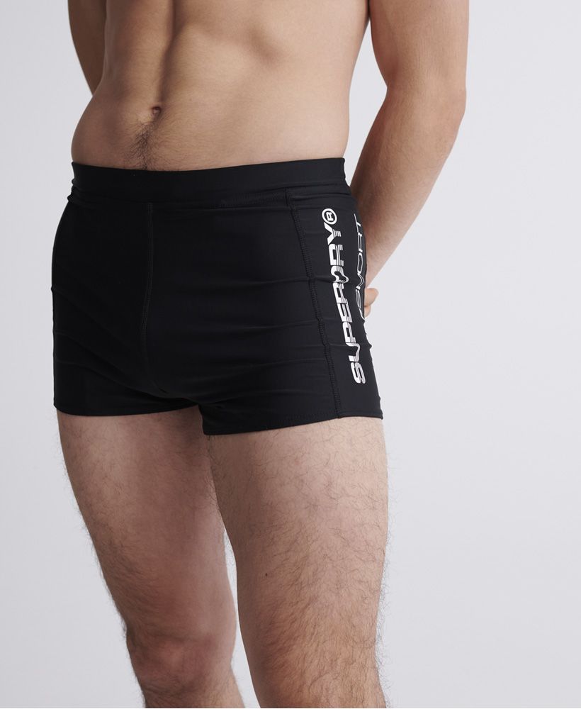 Superdry men's SwimSport midi shorts. Part of our Superdry Swim range these midi swim shorts feature a drawstring waist for the perfect fit. Finished with a Superdry Logo on the front and Superdry branded drawstring.