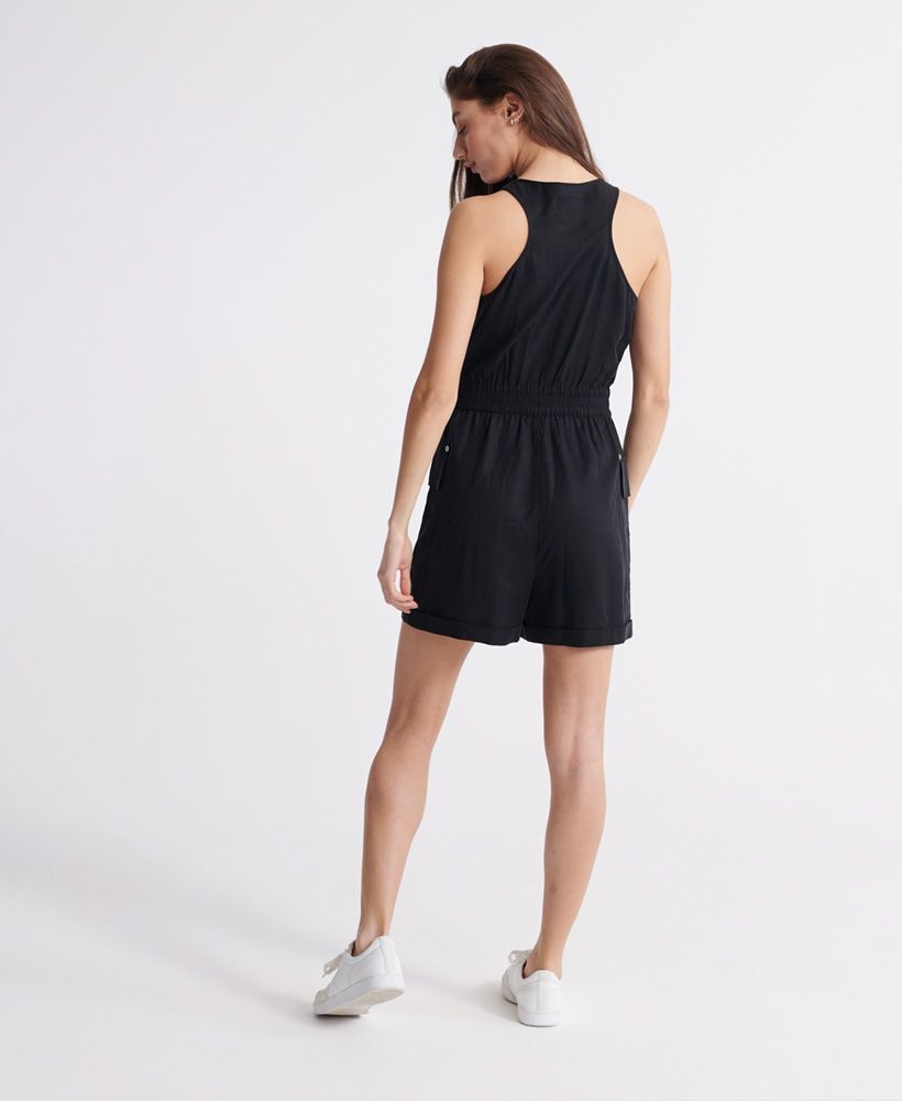 Superdry women's Nevada halter playsuit. This lightweight, sleeveless playsuit features a zip fastening, drawstring adjustable waist, and two front pockets. Finished with a small metal Superdry logo badge on one pocket.