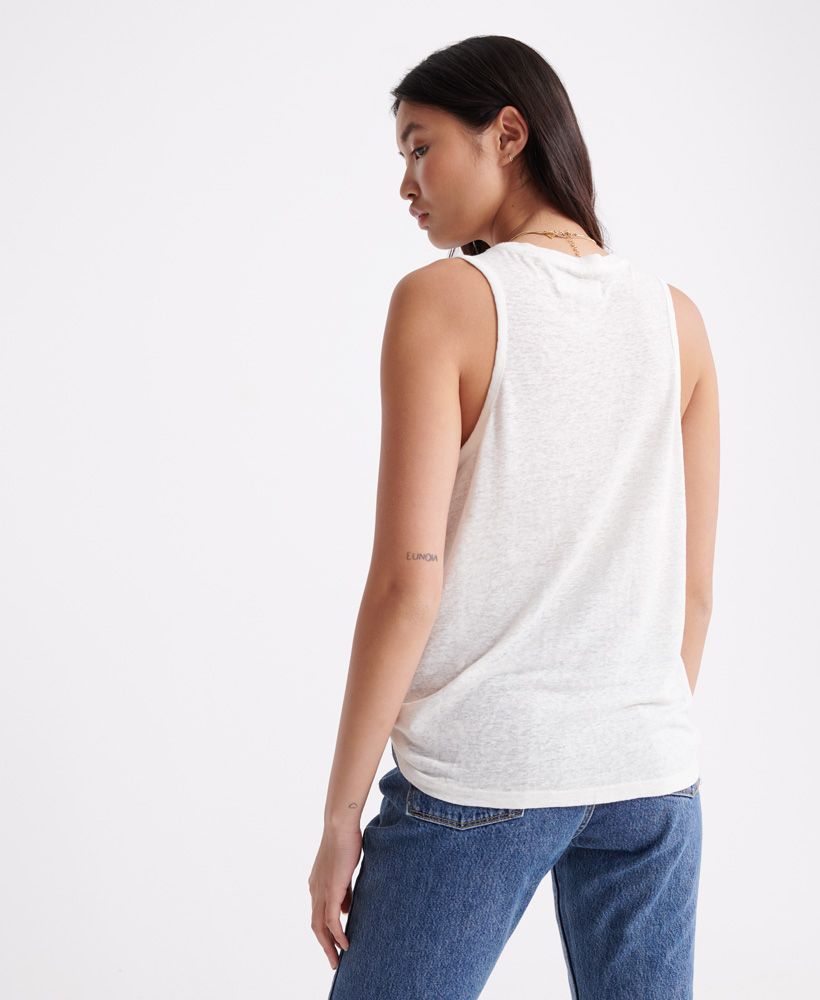 Superdry women's chevron lace vest top. This vest top features a chevron design with lace inserts, a ribbed neckline and trim. Finished with a Superdry logo tab on the hem.