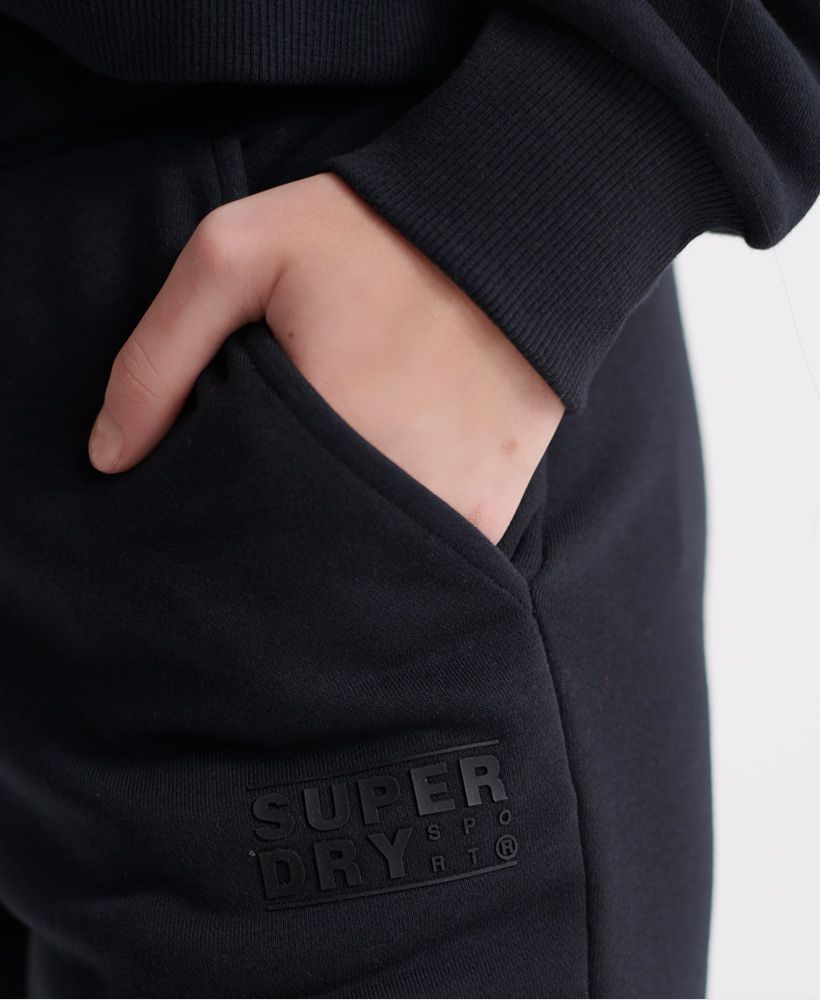 Superdry women's Core sport joggers. These sport joggers were designed with your comfort in mind featuring an adjustable drawstring waistband, ribbed cuffs and two front pockets. Finished with a rubberised Superdry logo on the front and Japanese characters on the back.