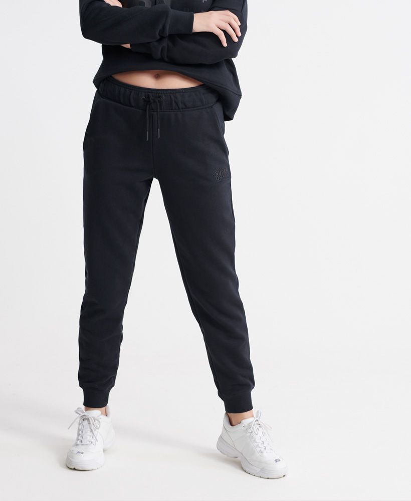 Superdry women's Core sport joggers. These sport joggers were designed with your comfort in mind featuring an adjustable drawstring waistband, ribbed cuffs and two front pockets. Finished with a rubberised Superdry logo on the front and Japanese characters on the back.
