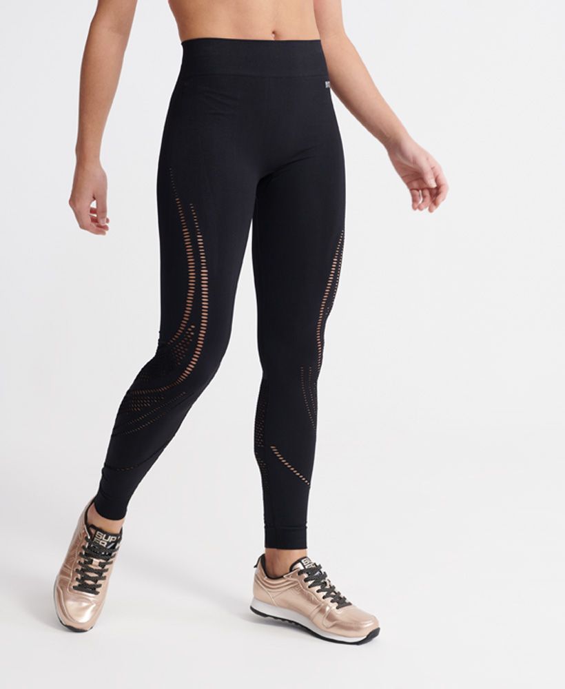 Superdry women's Studio seamless sports leggings. Mix up your workout wardrobe with these stylish four way stretch leggings featuring a cut out design throughout. These leggings are finished with a Superdry logo under the elasticated waistband.Fitted: A body sculpting fit, tight to the body