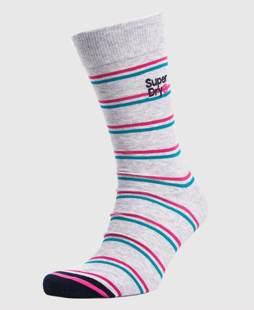 Superdry men's City sock triple pack. Update your wardrobe basics this season with our City socks. These sleek and soft socks feature an all over pattern design and ribbed hems. Completed with Superdry logo detailing on the underside and an embroidered Superdry logo under the hem.S/M - UK 7-9, EU 41-43, US 8-10M/L - UK 9-11, EU 43-45, US 10-12Made with Organic Cotton - Made using cotton grown using organic farming methods which minimise water usage and eliminate pesticides, maximising soil health and farmer livelihoods.