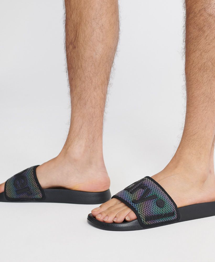 Superdry men's Mesh beach sliders. These sliders feature a padded mesh front strap and a moulded sole for comfort. Finished with a rubberised Superdry logo and Japanese characters on the strap and a Superdry logo on the outer sole.S - UK 6-7, EU 40-41, US 7-8M - UK 8-9, EU 42-43, US 9-10L - UK 10-11, EU 44-45, US 11-12XL - UK 12-13, EU 46-47, US 13-14