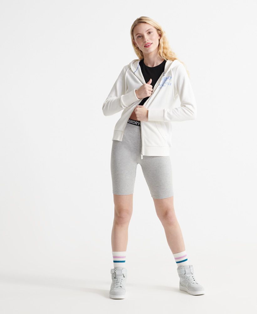 Superdry women's Track & Field loopback zip hoodie. This hoodie features a zip fastening, two front pockets and a textured Superdry logo on the chest. Complete with ribbed cuffs and hem. Layer this zip hoodie over a classic tee with jeans to complete the look this season.Slim fit – designed to fit closer to the body for a more tailored look