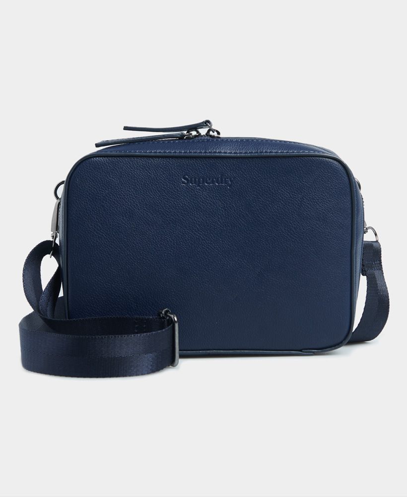 Superdry women;s Summer crossbody bag. This bag features an adjustable strap that can be removed, a main two way zipped compartment and two inside zipped pockets. Finished with an embossed Superdry logo to the front and side.W x 22cm H x 15cm D x 5cm