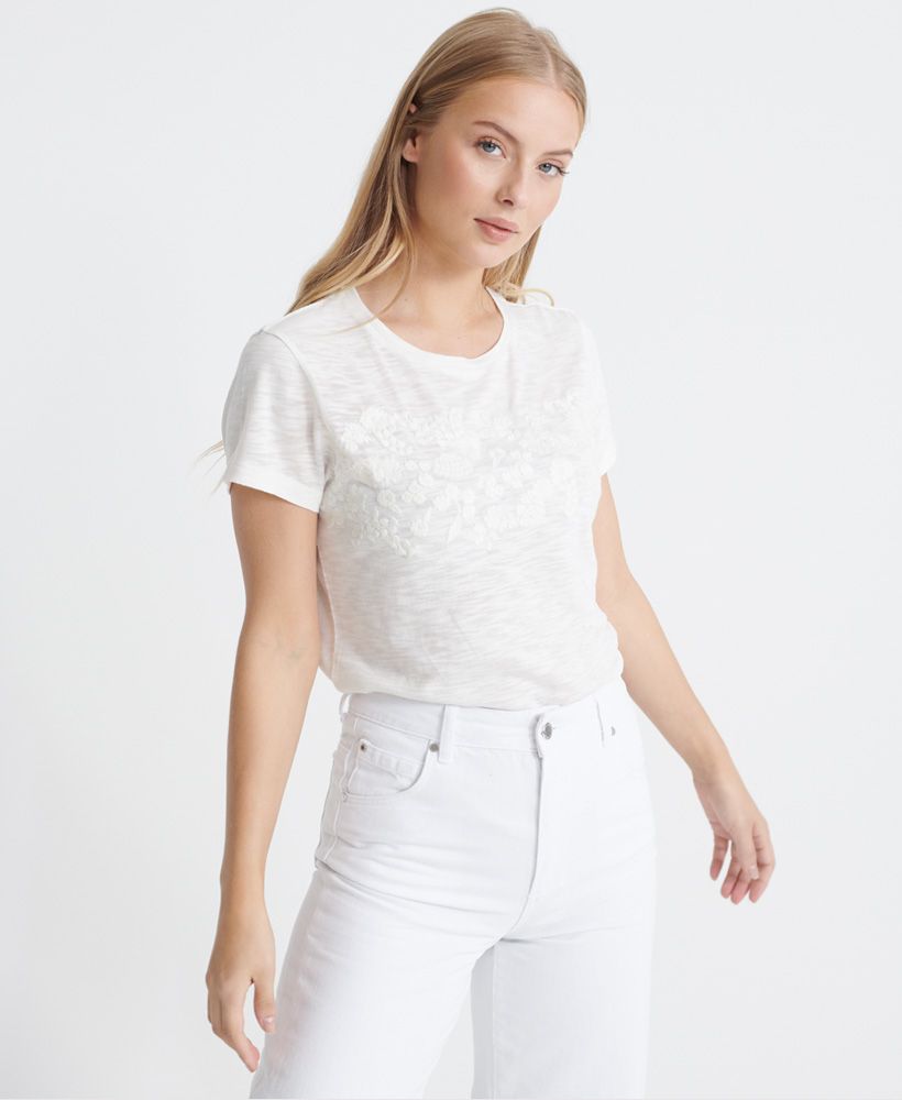 Superdry women's Tinsley embroidery T-shirt. A lightweight tee featuring a crew neck, short sleeves and an embroidered Superdry logo and floral design across the chest. Finished with a Superdry logo tab on the hem.