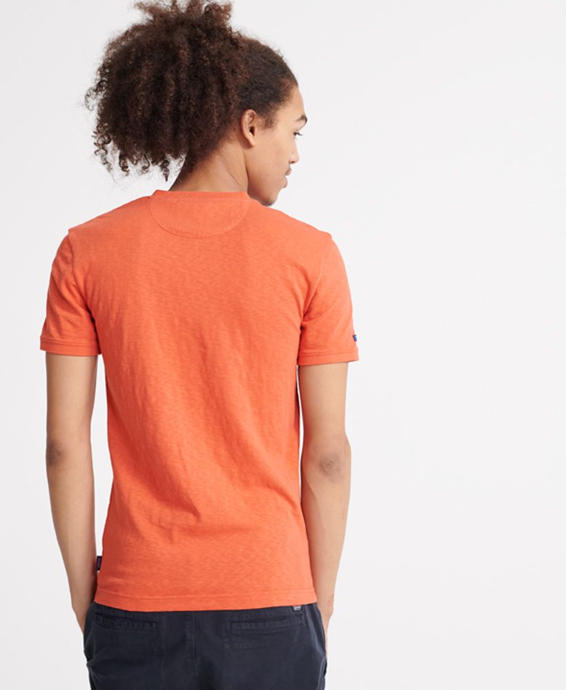 Superdry women's Heritage short sleeved henley T-shirt. This short sleeved tee features a button up design, a henley style collar and ribbed collar and cuffs. Finished with a Superdry logo tab to one side seam.