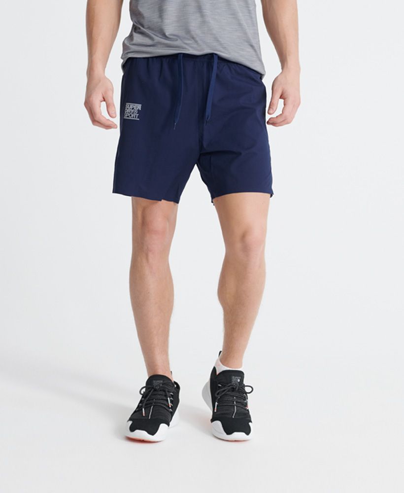Superdry men's Training double layer shorts. These shorts are perfect for any workout, featuring fabric to help you stay cool so you can train for longer. The Training double layer shorts feature an elasticated drawstring waistband, panel detailing with a zip pocket on one side and split side seams. Complete with reflective Superdry Sport logo detailing on the front and back to ensure you stay visible during training.