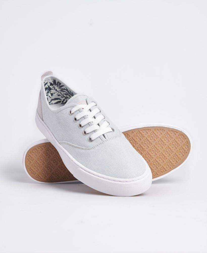 Superdry men's Edit Casual Shoe. These shoes feature a five eyelet lace fastening, a leather panel on the heel with a heel pull tab and Superdry branding on the insole. Finished with a leather Superdry patch on the tongue and Superdry branding on the outer sole and heel.