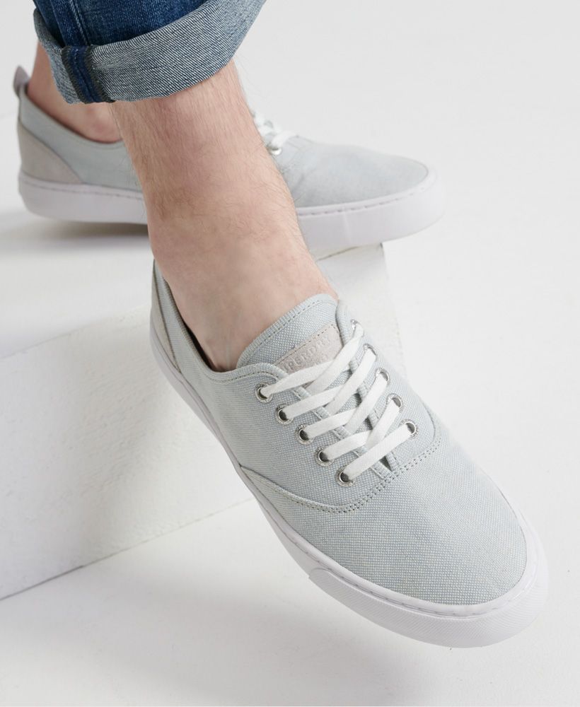 Superdry men's Edit Casual Shoe. These shoes feature a five eyelet lace fastening, a leather panel on the heel with a heel pull tab and Superdry branding on the insole. Finished with a leather Superdry patch on the tongue and Superdry branding on the outer sole and heel.