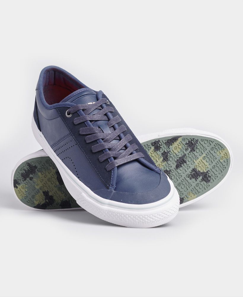 Superdry men's Skate classic low trainers. These comfy trainers feature a lace fastening, brightly coloured insoles, and camo printed soles. Finished with a printed Superdry logo on the tongue, and debossed Superdry branding on the sole.