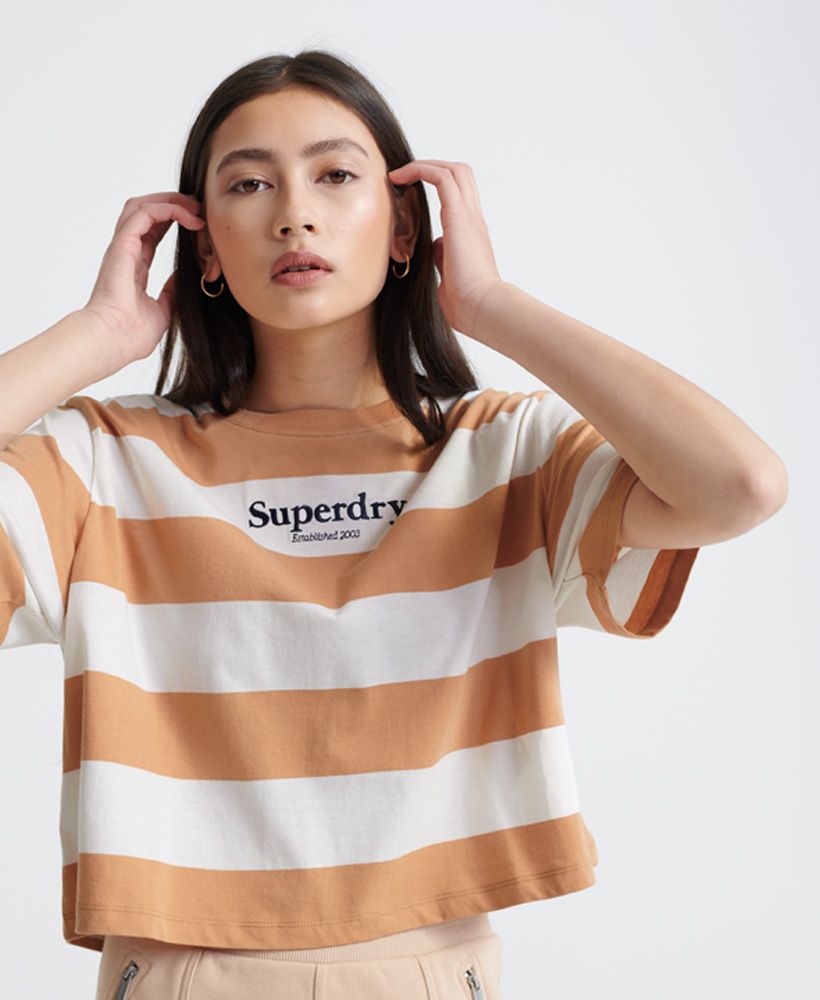 Superdry women's Harper stripe boxy t-shirt. This boxy tee features short sleeves, a crew neckline, and a striped design. Finished with an embroidered Superdry logo on the chest, and an embroidered Superdry logo badge on the hem.