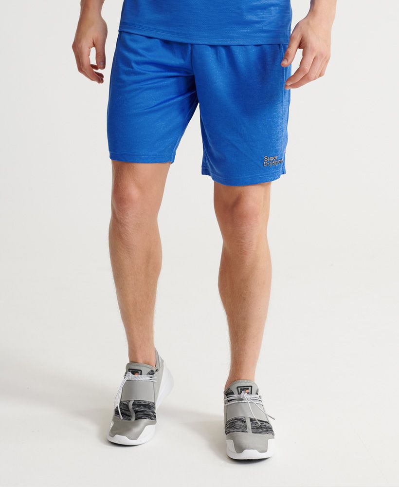 Superdry men's Training shorts. These stretchy and lightweight shorts are made from Superdry fabric, designed to keep you dry and cool for longer. Featuring a drawstring waist, two zip fastened pockets, and split side seams. Finished with a reflective Superdry logo above the hem.