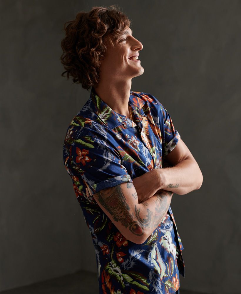 Superdry men's Hawaiian box short sleeve shirt. A lightweight shirt featuring an all over print design, a main button down fastening, short sleeves and small sides seam splits. Finished with a Superdry logo patch above the hem.