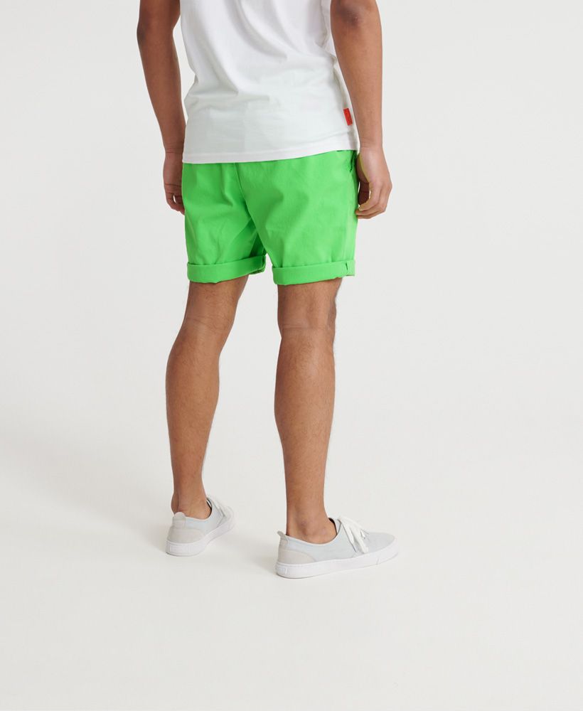 Superdry men's Sunscorched chino shorts. Be ready for the warmer weather with these shorts featuring an elasticated drawstring waistband, a button and zip fly fastening and a five pocket design. Finished with a Superdry logo patch on the back.Perfect for pairing with a vest top and flip flops for a beach ready look this season.
