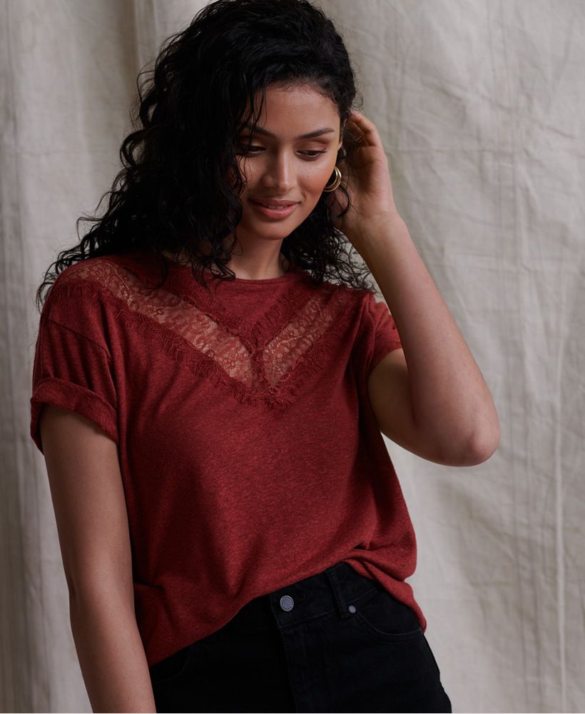 Superdry women's Chevron lace T-shirt. This short sleeved tee features a linen blend material, a ribbed crew neck collar and a chevron design with lace insert detailling. Finished with a Superdry logo tab on the hemline.