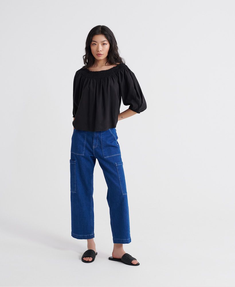 Superdry women's Desert off shoulder top. This top features a bardot design, elasticated neckline and cuffs. Finished with a metal Superdry logo tab on the hem. The Desert off shoulder top will look great paired with jeans to complete the look this season.