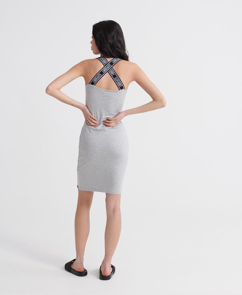 Superdry women's City jacquard bodycon dress. With Superdry branded cross-over straps, this flattering sleeveless dress features a small logo tab on the hem. Style it your way with your favourite casual jacket and low tops.