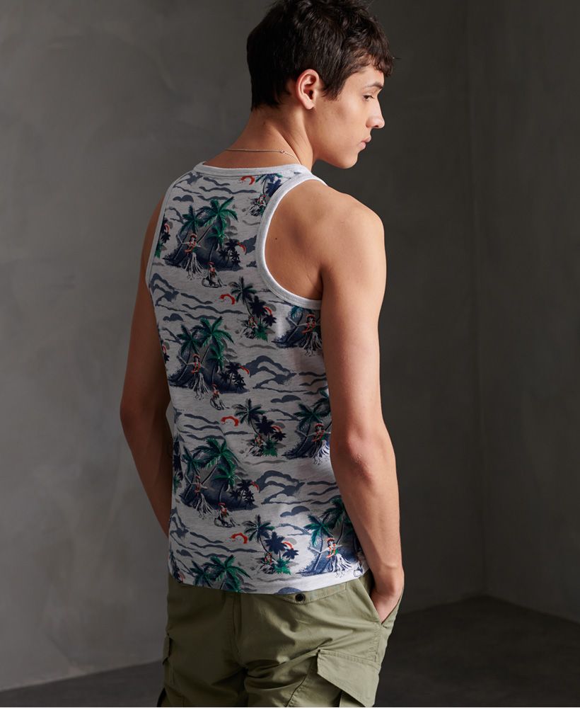 Superdry men's All Over Print supply vest top. Update your vest collection this season with this vest top featuring a ribbed trim on the neck and straps, an all over print design and an embroidered Superdry logo on the chest.