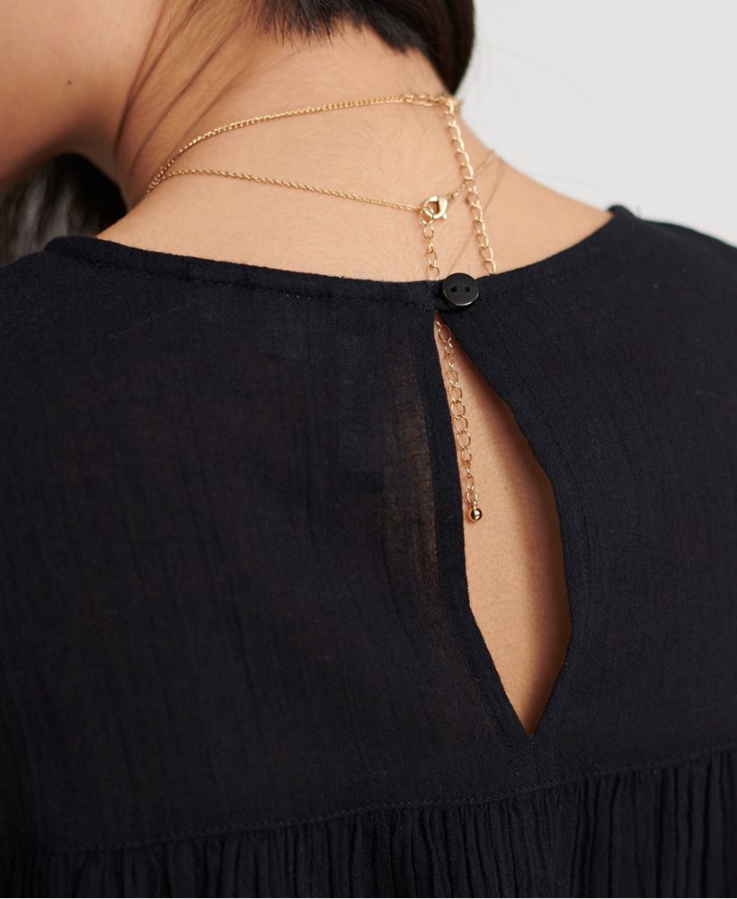 Whether you pair this with a skirt or jeans you are guaranteed to wow. Perfect for making those office outfits cute but professional or layering under your favourite jumpsuits.Button cufflace detaillingRuched designKeyhole back with button fasteningLong SleevesMetal logo badge