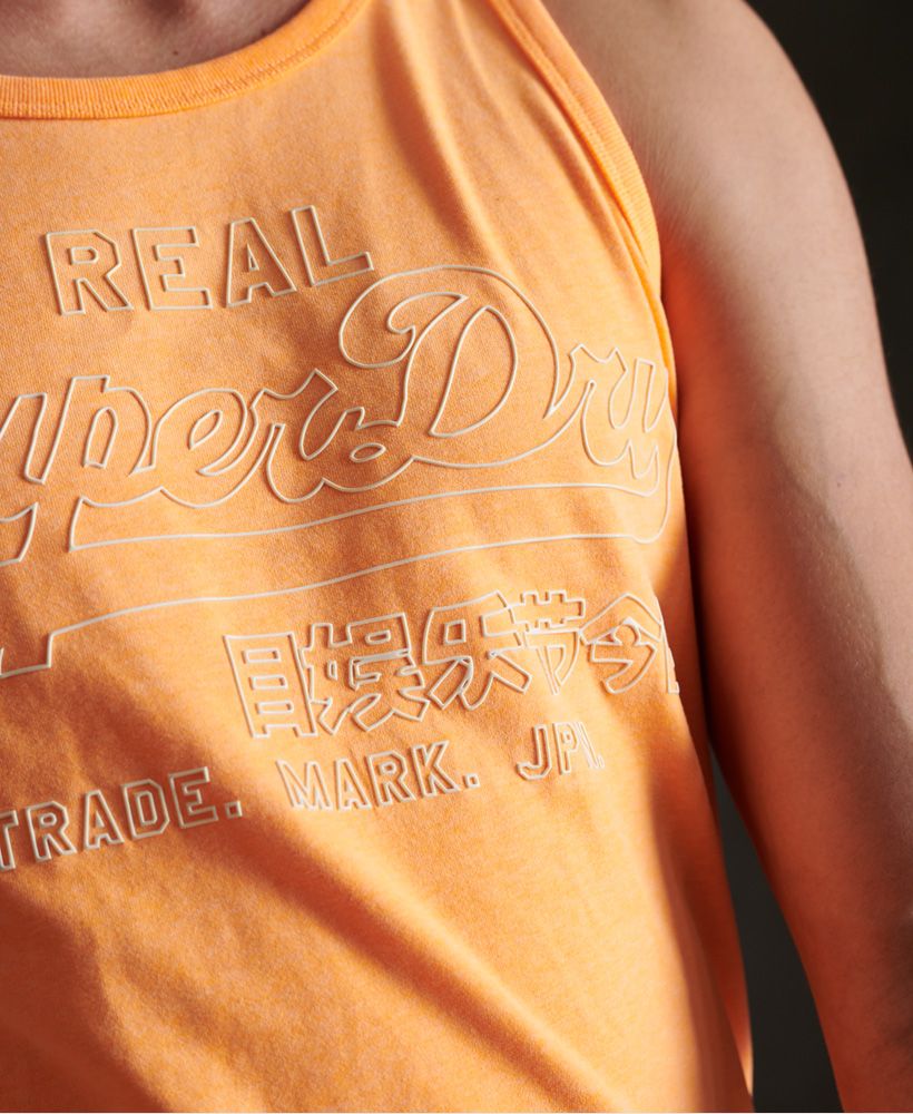 Superdry men's Vintage Logo outline pop vest top. This sleeveless vest top features a relaxed crew neckline, and ribbed trims. Finished with a textured Superdry outline graphic across the chest.