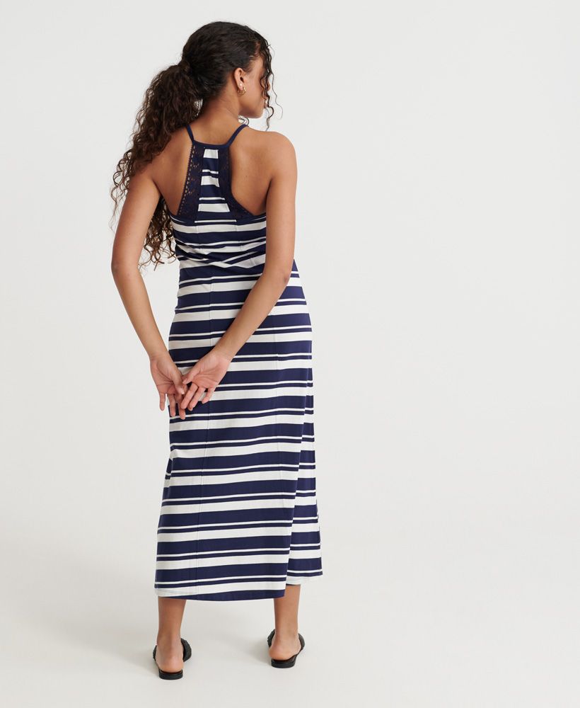 Superdry women's Summer stripe maxi dress. This maxi dress features a racer style back with crochet detailling, spaghetti straps and an all over striped design. Finished with a Superdry logo tab on the hemline.