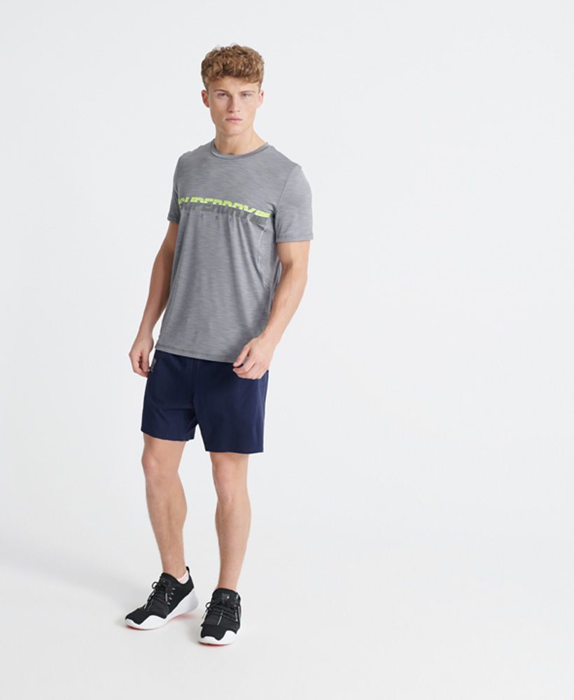 Superdry men's Training double layer shorts. These shorts are perfect for any workout, featuring fabric to help you stay cool so you can train for longer. The Training double layer shorts feature an elasticated drawstring waistband, panel detailing with a zip pocket on one side and split side seams. Complete with reflective Superdry Sport logo detailing on the front and back to ensure you stay visible during training.