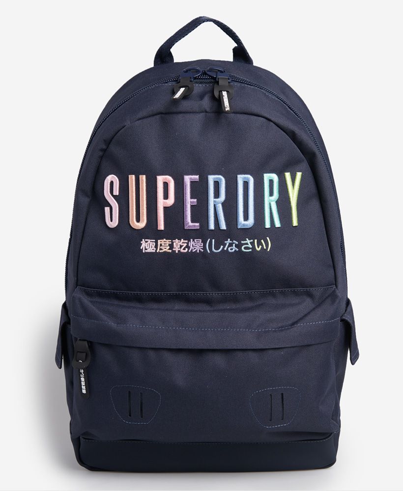 Superdry women's Rainbow Montana rucksack. Stay on trend this season with this stylish rucksack. The bag features a large zip fastened main compartment with two internal pockets. This also features a zipped front compartment with two side popper fastened compartments. There are also adjustable padded straps and a top handle. This is finished with a Superdry patch on one strap and embroidered Superdry logo on the front.H 47cm L 31cm D 14cm