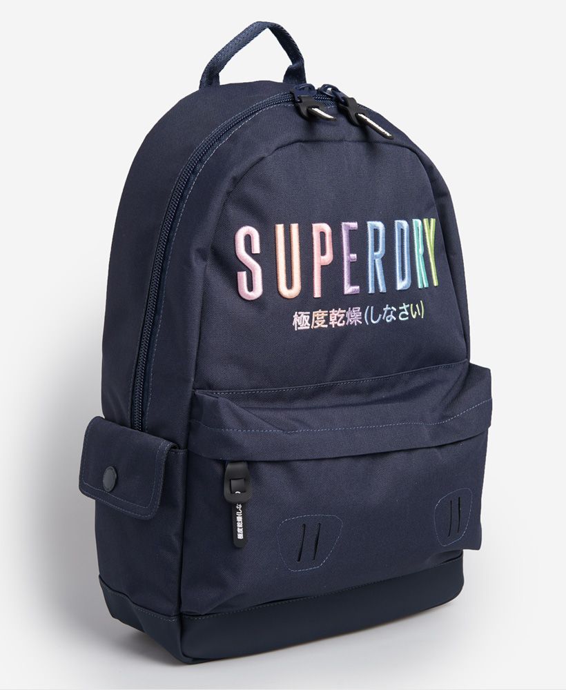 Superdry women's Rainbow Montana rucksack. Stay on trend this season with this stylish rucksack. The bag features a large zip fastened main compartment with two internal pockets. This also features a zipped front compartment with two side popper fastened compartments. There are also adjustable padded straps and a top handle. This is finished with a Superdry patch on one strap and embroidered Superdry logo on the front.H 47cm L 31cm D 14cm