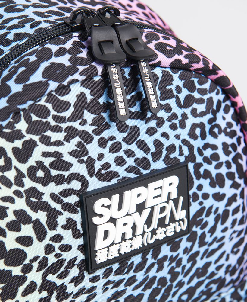 Superdry women's Repeat series montana rucksack. Get back to it in style this season with a rucksack from Superdry. Featuring adjustable straps, a handle, a large main compartment with two zips, a smaller front compartment, and two side pouches. Finished with a rubber Superdry logo on the front and branded zips.21 litre approximate main compartment capacity.H 46cm x W 30.5cm x D 13.5cm