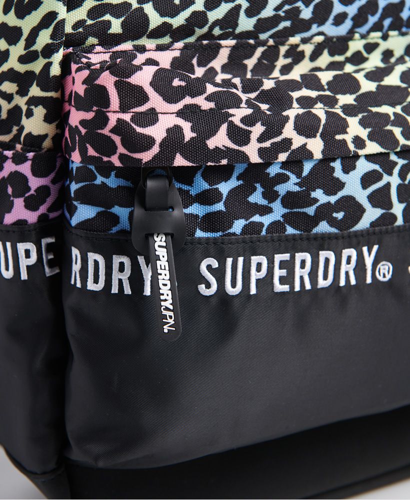 Superdry women's Repeat series montana rucksack. Get back to it in style this season with a rucksack from Superdry. Featuring adjustable straps, a handle, a large main compartment with two zips, a smaller front compartment, and two side pouches. Finished with a rubber Superdry logo on the front and branded zips.21 litre approximate main compartment capacity.H 46cm x W 30.5cm x D 13.5cm
