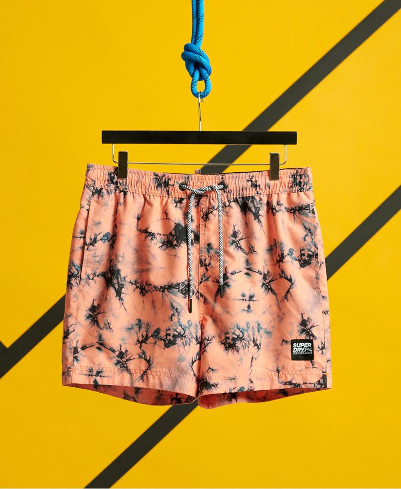 Going swimming? Then you need a new pair of water repellent swim shorts with a bold print. These shorts are bright, full of colour, and guaranteed to make a splash this season.Water repellentElasticated drawstring waistTwo front pocketsHook and loop fastened back pocketSignature logo patchRubberised signature logo tabPlease note due to hygiene reasons, we are unable to offer an exchange or refund on swimwear, unless they are sealed in their original packaging. This does not affect your statutory rights.