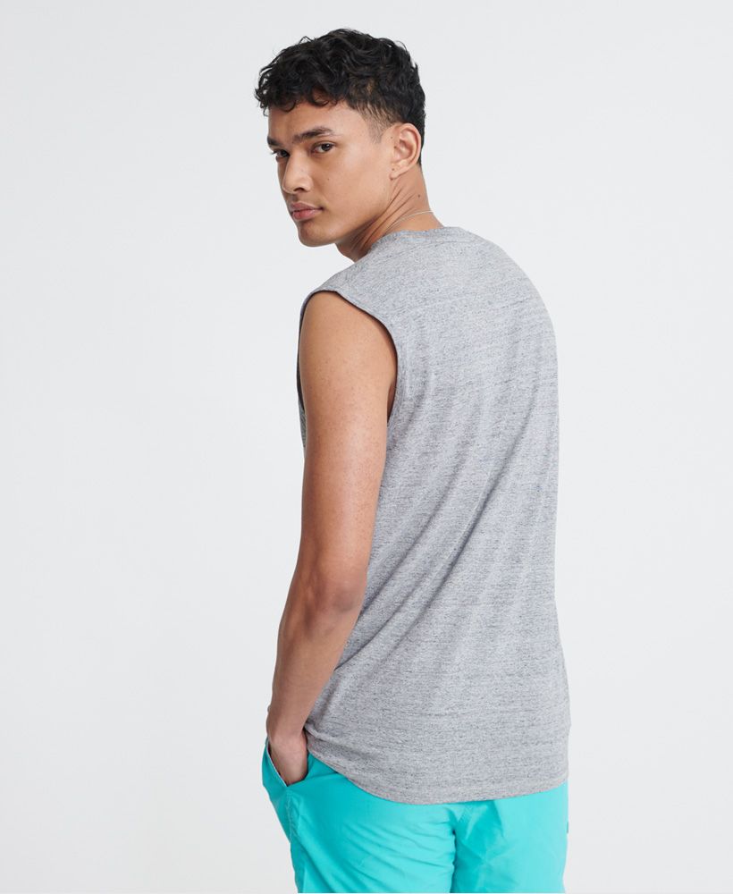 Superdry men's Collective oversized vest. Update your vest collection for those warmer days with this vest featuring a ribbed crew neck, trim armholes, a Superdry logo badge on the chest and Superdry logo tab on one side seam.Made with Organic Cotton - Made using cotton grown using organic farming methods which minimise water usage and eliminate pesticides, maximising soil health and farmer livelihoods.