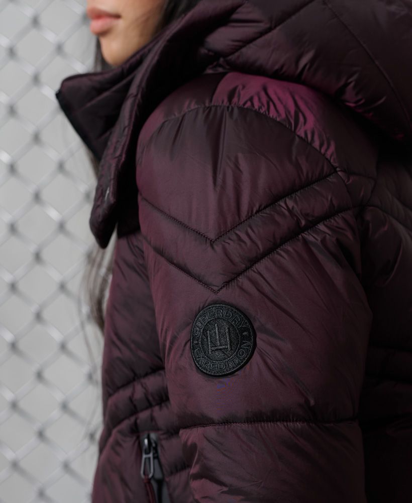 Keep the cold out with our Geo Luxe Quilt jacket, designed to keep you warm while looking amazing at the same time.Popper fastened hoodZip fasteningTwo pocketsZipped cuffsThe padding in this jacket is 100% Recycled Polyester – each jacket contains up to 10 recycled bottles, this avoids these bottles being sent to landfill or polluting our oceans.