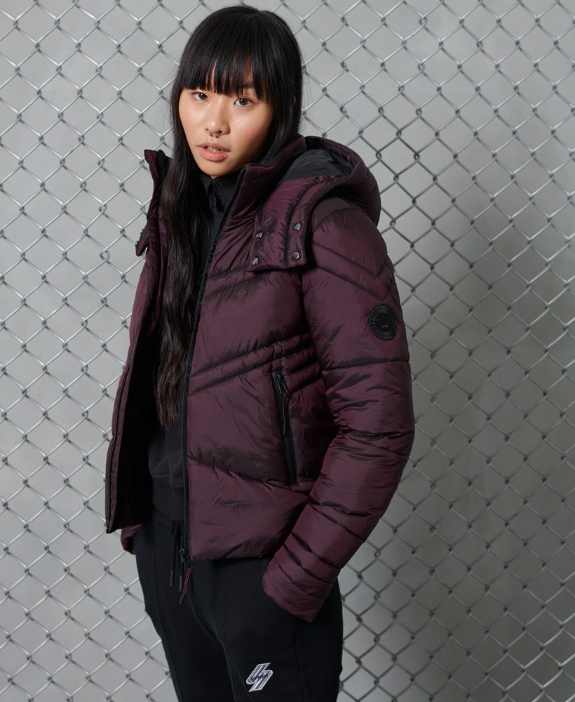 Keep the cold out with our Geo Luxe Quilt jacket, designed to keep you warm while looking amazing at the same time.Popper fastened hoodZip fasteningTwo pocketsZipped cuffsThe padding in this jacket is 100% Recycled Polyester – each jacket contains up to 10 recycled bottles, this avoids these bottles being sent to landfill or polluting our oceans.