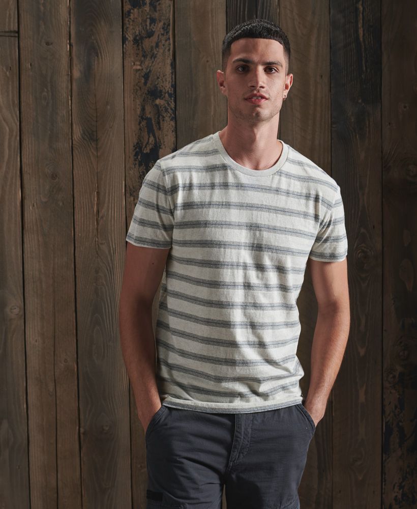 Update your tee collection with the Off Piste stripe tee. This 100% Organic cotton tee features an all over striped design and will look great paired with your favourite pair of jeans.Slim fit – designed to fit closer to the body for a more tailored look100% Organic cottonCrew neckShort sleevesAll over striped designSignature logo patchMade with Organic Cotton - Grown using only organic inputs and no artificial chemicals, which leads to improved soil condition, stronger biodiversity and better health among the cotton growers and uses between 60-90% less water to grow. By 2030, all Superdry Cotton will be Organic.