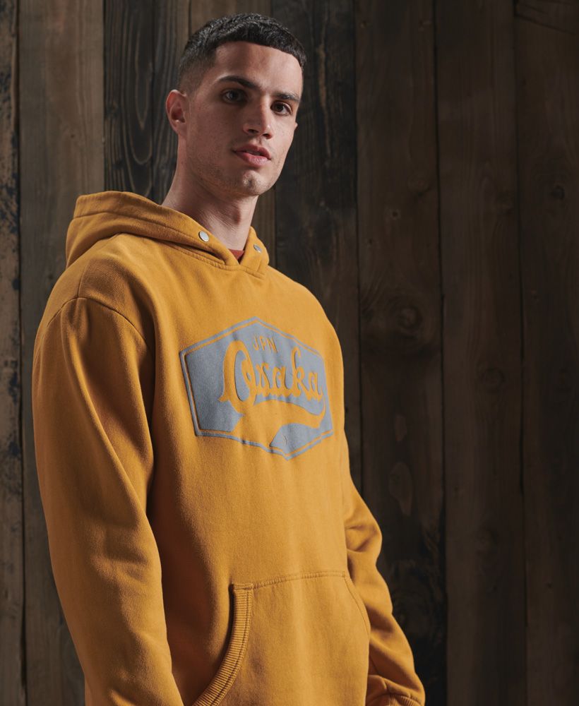 Update your wardrobe essentials this season with the Modern Workwear hoodie. Featuring a brushed lining, large pouch pocket and a textured graphic across the chest.Oversized fit – exaggerated and super relaxed, let your style flowBrushed liningRibbed cuffs and hemTextured graphicSignature logo patch
