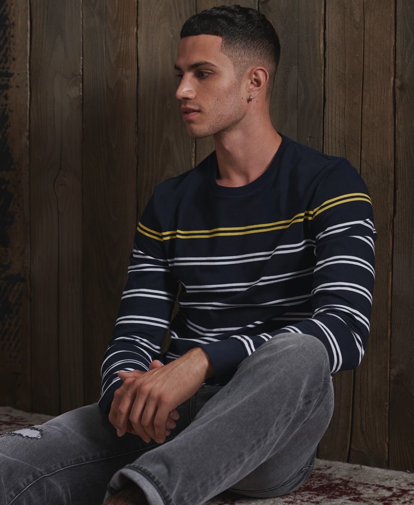 Simple, clean, sophisticated. Everything you need in an essential long sleeved top. Get a super sleek look with our Long Sleeved Breton Top.Slim fit – designed to fit closer to the body for a more tailored lookLong sleevesCrew necklineStripe designSignature logo patchMade with Organic Cotton - Grown using only organic inputs and no artificial chemicals, which leads to improved soil condition, stronger biodiversity and better health among the cotton growers and uses between 60-90% less water to grow. By 2030, all Superdry Cotton will be Organic.