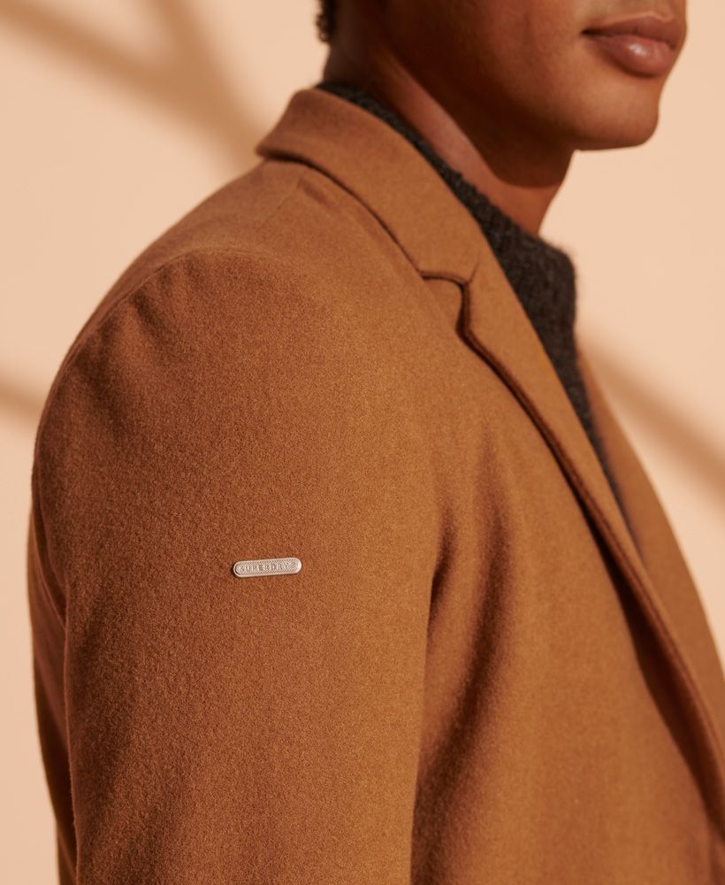 Essential for those colder days, this longline coat was designed with your warmth in mind to keep the cold out this season.Single breasted designButton fasteningButton detailingThree pocket designPadded shoulderSignature metal logo badge