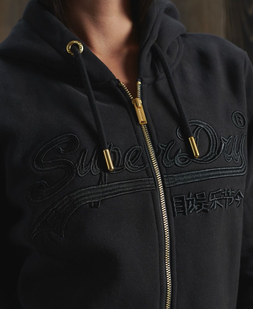 Enjoy a positive and joyful wardrobe and dress down with confidence with this Vintage Logo hoodie.Slim fit – designed to fit closer to the body for a more tailored lookLong SleeveZip fasteningEmbroidered vintage logoRibbed cuffs and hemDrawstring hood