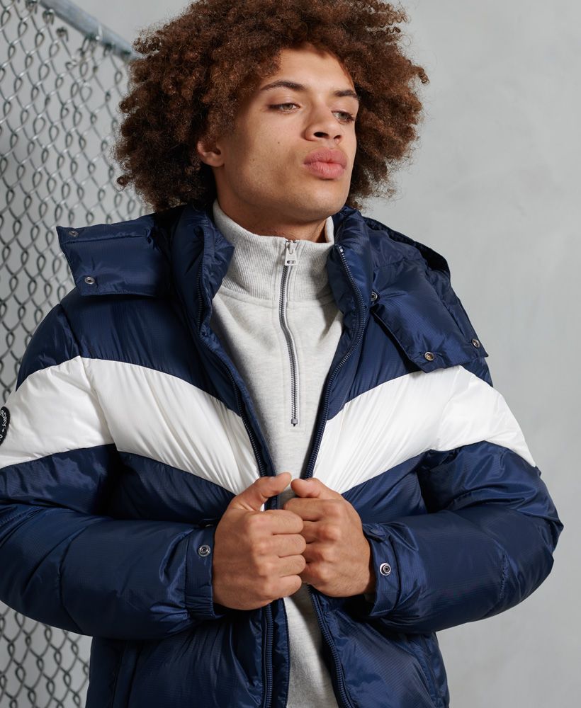 Keep warm in style this season with the Stratus Padded Jacket featuring a colourblock design, removable hood and Signature logo badge.Recycled polyester paddingZip fasteningPopper collarBungee cord hoodElasticated hemPopper cuffsRemovable hoodTwo front pocketsPuffer designSignature logo badgeThe padding in this jacket is 100% Recycled Polyester – each jacket contains up to 10 recycled bottles, this avoids these bottles being sent to landfill or polluting our oceans. 