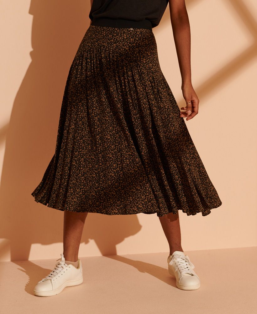 Step out with elegance this season in the Ronda midi skirt, featuring a gorgeous all over print and stunning pleats throughout. Complete the look with a pair of trainers, and a simple knitted jumper for a minimalistic, casual look, or heeled boots and a button up shirt for a smart, sophisticated outfit.All over printPleated designRear zip fasteningWaistbandSignature metal logo tab
