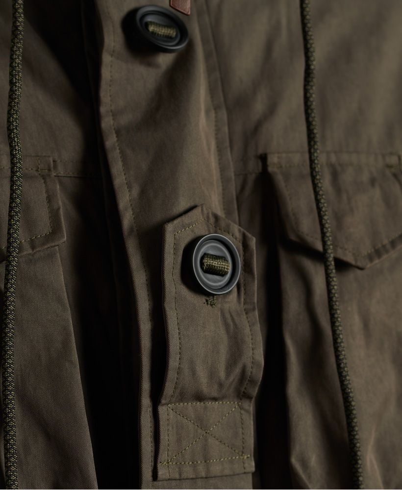 Whether you're leader or wingman, with the Squadron parka in your wardrobe, there's no doubt you'll feel like a hero on your next sortie. Military styling features heavily in this coat with multiple patch pockets and aviation inspired patches.Drawcord adjustable hoodZip and button fasteningExternal waist drawcord adjusterEpaulette detailingButton cuffsQuilted liningSignature branding
