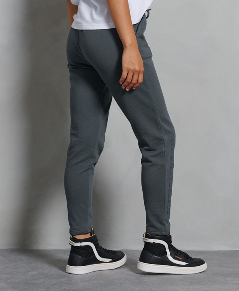 Joggers that stand out front the rest the Sportstyle Embossed Joggers features a subtle Superdry embossed logo dopwn one leg and piping detailing throughout.Elasticated waistDrawstring fasteningTwo front pocketsPiping detailingSignature logo badgeEmbossed logo